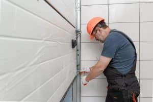 expert repairing a garage door