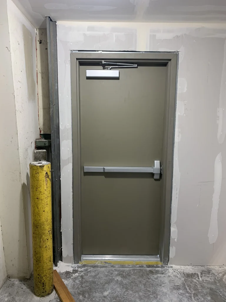 robust egress code compliance provided by a professional hollow metal door installation